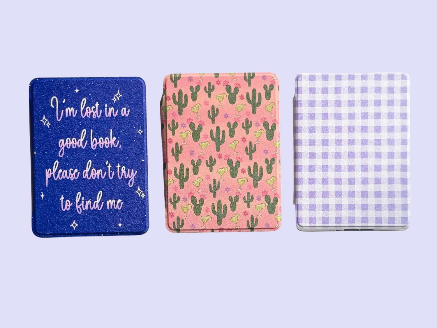 Three custom printed kindle cases on a white background.